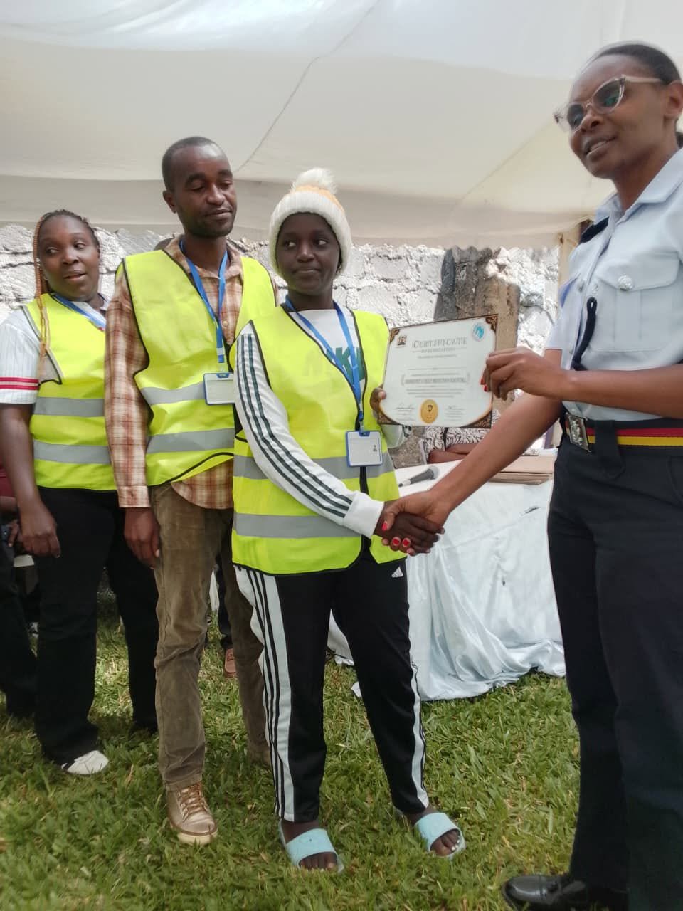 Team members with their certificates